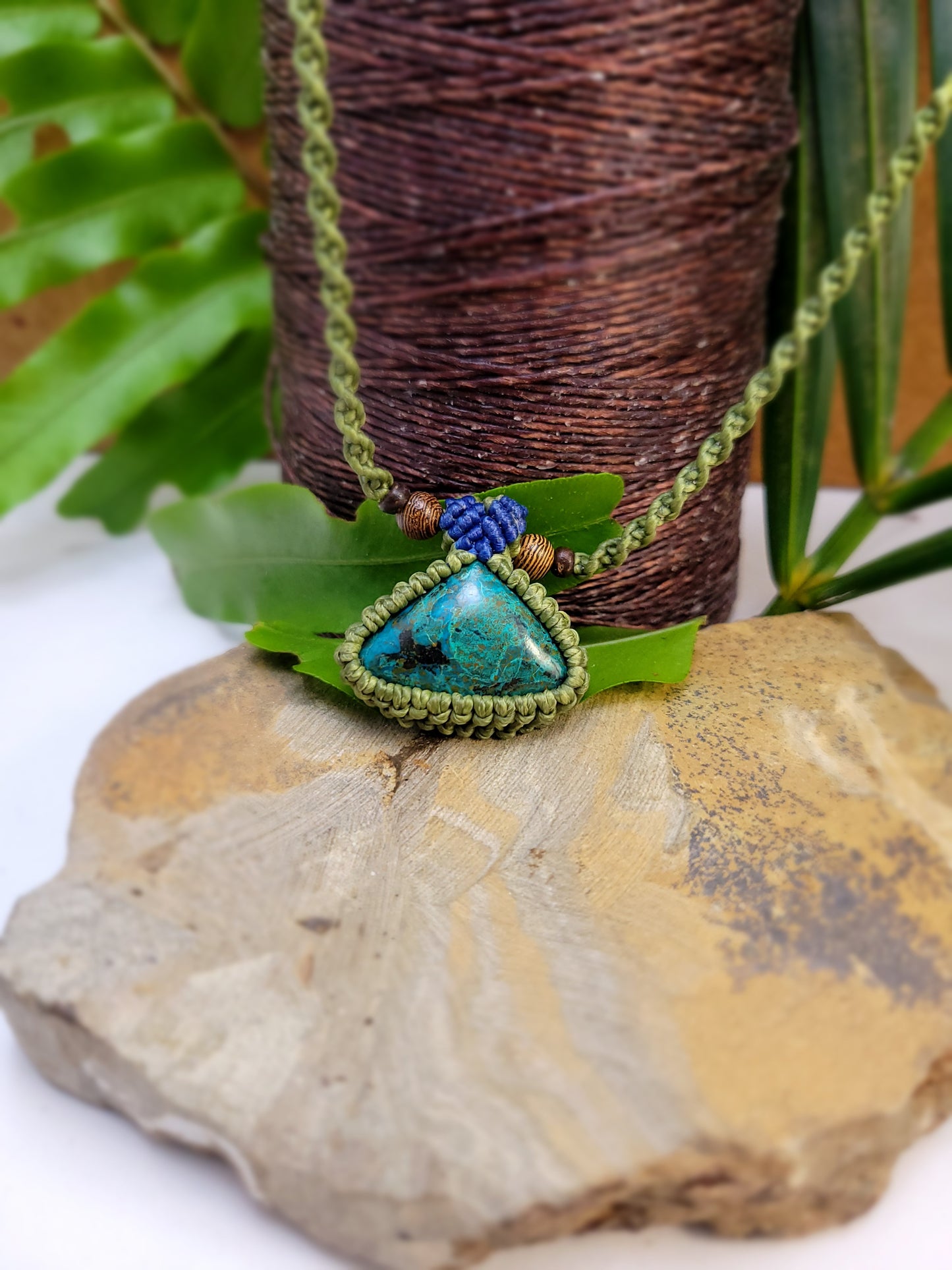 Handcrafted Triangular Cabochon Stone Pendant Necklace – 12-Inch Olive Green Macrame with Blue Accents and Wood Beads